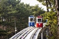 Korean people and foreign travelers sitting passengers journey on Sky Capsule Tram Haeundae Blue Line at Mipo Station for travel