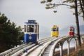 Korean people and foreign travelers sitting passengers journey on Sky Capsule Tram Haeundae Blue Line at Mipo Station for travel