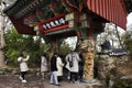 Korean people and foreign travelers walking passing gate entrance travel visit and respect praying bless wish in Haedong