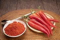 Korean pepper and red pepper in wooden plate, Korean Korean chili powder on a wooden table background.