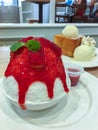 Korean shaved ice topped with strawberry syrup, Bingsu or Bingsoo