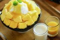 Korean shaved milk ice topped by fresh mango.