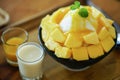 Korean shaved milk ice topped by fresh mango.