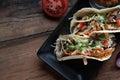 Korean short rib tacos with spring onion tomato salsa