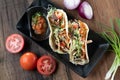 Korean short rib tacos with spring onion tomato salsa