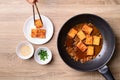 Korean side dish, spicy braised tofu Dubu Jorim in cooking pan Royalty Free Stock Photo