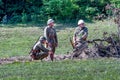 Korean soldiers in Vintage uniforms, hide behind brush