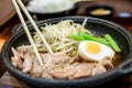 Korean spicy bbq pork served on a hot plate with side dishes. Royalty Free Stock Photo