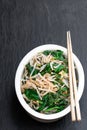 Korean spinach mung bean sprouts salad on black stone background