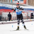Korean sportswoman biathlete Choi Yoonah skiing on distance biathlon stadium. Junior biathlon competitions East of Cup