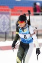 Korean sportswoman biathlete Lee Hyunju South Korea skiing at finish after rifle shooting during Open regional youth