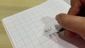 Korean Studying Hand Writing. Writing Hello with brush pen in Hangul Korean alphabet.