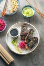 Korean style beef short ribs with colourful radish and rice, close view