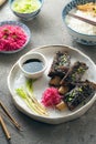 Korean style beef short ribs with colourful radish and rice, close view