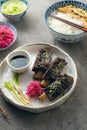 Korean style beef short ribs with colourful radish and rice, close view