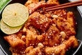 Korean Sweet Fried Chicken Dakgangjeong in black bowl. Korean Food. Close up Royalty Free Stock Photo