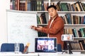 Korean Teacher Teaching Group Of Students Via Video Call Indoor Royalty Free Stock Photo
