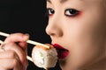 Korean teenager girl eating roll closeup Royalty Free Stock Photo