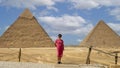 Korean tourist, The Pyramid of Khafre and The Great Pyramid of Khufu photographed from the 9 Pyramids Lounge in Giza, Egypt. Royalty Free Stock Photo