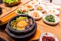 Korean traditional dish- bibimbap mixed rice with vegetables Include beef and fried egg and pickles set Royalty Free Stock Photo