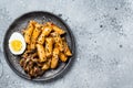 Korean Tteokbokki, Topokki fried rice cake stick in Hot and spicy sauce. Gray background. Top view. Copy space Royalty Free Stock Photo