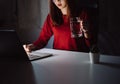 Korean woman working late time with laptop computer drinking water home office workhard overworked Royalty Free Stock Photo