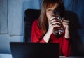 Korean woman working late time with laptop computer drinking water home office workhard overworked Royalty Free Stock Photo