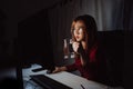 Korean woman working late time with laptop computer drinking water home office workhard overworked Royalty Free Stock Photo