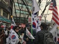 Koreans Protest with Korean, American Flags