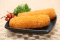 Korokke or Croquette the traditional japanese food two slice a deep-fried dish mashed potatoes or imo cheese. serving on the plate