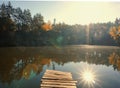 Korostyshevsky quarry, Ukraine. Bright sun over the forest is reflected in the lake Royalty Free Stock Photo