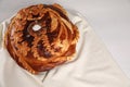 Korovai on white table, above view. Ukrainian bread and salt welcoming tradition