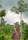 Korowai Kolufo old man with bow and arrows on the natural green forest background Royalty Free Stock Photo