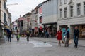 Kortrijk, West Flanders Region - Belgium - People of all ages and families walking through the shopping street of old town