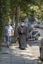 View of an Orthodox priest walking on the street in island of Kos, Greece