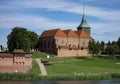 Kosciol Rzymskokatolicki pw. sw. Jana Chrzciciela church in Malbork with Nogat river at sunny day Royalty Free Stock Photo