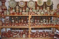 Earthenware on the shelves of shop. Pottery for sale