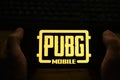 Kostanay, Kazakhstan, November 01, 2021.In the hands of a mobile phone with the logo of the popular mobile game PUBG