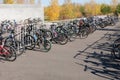 Kostanay, Kazakhstan, 2019-10-06. Bike ride. Parking bicycles of different brands in nature. Autumn, yellow leaves on the trees.