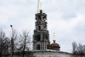 Kostroma Kremlin bell tower, fortress. Construction restoration. Sky clouds. The bell tower of the Epiphany Cathedral was