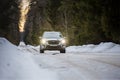 Kostroma, Russia - November 8, 2022: Silver Subaru Forester drives through the forest on a snowy road in winter
