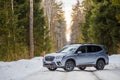 Kostroma, Russia - November 8, 2022: A silver Subaru Forester stands on the road in a snowy winter forest