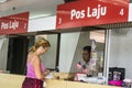 Kota Kinabalu Sabah Malaysia - August 26th, 2017 : An unidentified tourist lady being assisted by an counter staff. Pos Laju Mala