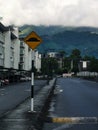 Speed bump sign beside asphalt road. Royalty Free Stock Photo