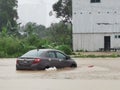 Outdoor scenery during raining season with flash flood at Menggatal Road. Royalty Free Stock Photo