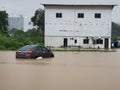 Outdoor scenery during raining season with flash flood at Menggatal Road.