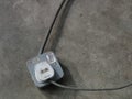 Image of Plug top with metal clad 13A switch socket outlet on the concrete floor. Royalty Free Stock Photo