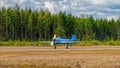 Two-seat single-engined piston-powered Yakovlev Yak-52 primary aerobatic trainer aircraft OH-YAC landing on Karhula aviation Royalty Free Stock Photo