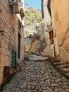 Ruined historical buildings in the narrow streets of Old Town in Kotor during sunset Royalty Free Stock Photo