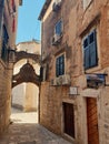 Ruined historical buildings and shops in the narrow streets in Old Town in Kotor Royalty Free Stock Photo